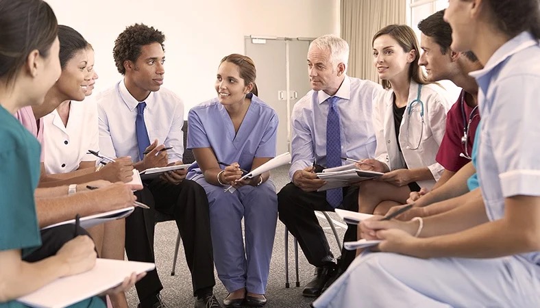 Group of healthcare workers chatting..